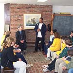 A group of students enjoying a lesson in the Defenders Room.