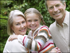 Picture of two older adults and a child