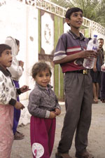 Iraqi boys receive humanitarian aid. [US Department of Defense]