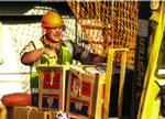 Construction workers unloading humanitarian aid at an Iraqi port. [Source: USAID]