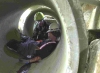 Rescue workers in pipe