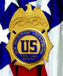 Picture of a DEA badge with an American flag as a background.