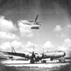 A R-1B of the 1st Aircraft Repair Unit supplies critical parts to a B-29 unit operating in the Marianas during World War II