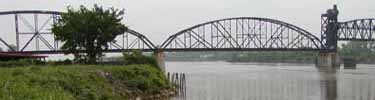 Bridge crossing placid river on Water Route, Arkansas River, North Little Rock, Arkansas