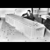 Chief engineer of Los Angles, O.R. Angelillo, demonstrates a model skyscraper air terminal