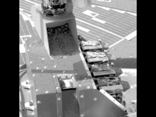 Martian soil sprinkled into sample wheel of microscope