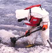 Spill responder applies countermeasures to shoreline in an Alaskan environment.