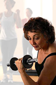 photo of a woman lifting weights
