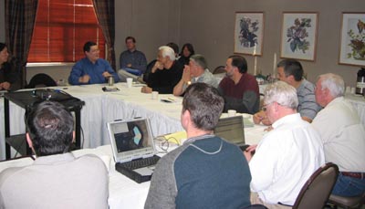 Members of the Restoration Advisory Board engage in discussion at a meeting in Anchorage, Alaska.
