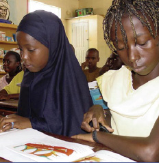 Students in Senegal reading from new textbooks.