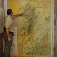 Photo of Forest Service Employee pointing at a map