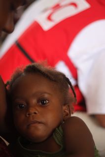 A Haitian child finds shelter in a school in the southern city of Jacmel, where 500 people are unable to return to their communities after successive hurricanes have pummeled the island. “Most western towns are still cut off,” explains Colin Chaperon, the American Red Cross relief team leader. American Red Cross relief teams are working tirelessly with the Haitian Red Cross to get help to isolated communities reeling from the deadly disaster. (Matt Marek/American Red Cross)