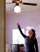 photo of woman turning off light