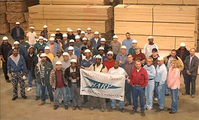 Anthony Forest Products Employees with SHARP Flag, El Dorado, AR