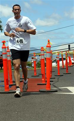Anthony Langford strides to the finish line during the 12th Annual 5K Grueler Sept. 17.  
