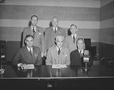 Honorable William A. M. Burden, Special Aviation to Secretary of Commerce; Willard E. Givens, Executive Secretary, National Education Association; John W. Studebaker, U. S. Commissioner of Education. Seated, left to right: the Honorable ralph A. Bard, Assistant Secretary of the Navy; Paul V. McNutt, Chairman of the War Manpower Commission (WMC) ; Robert P. Patterson, the Undersecretary of War.