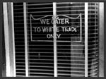 Sign on a restaurant, with a sign: 'We Cater to White Trade


     only.'