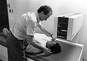 A patient being maesured using a dexa machine.