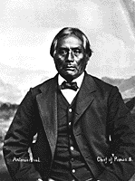 A picture, taken in the 19th century, of a Pima man wearing a European suit and bow tie.