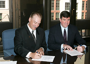 Tim Lawrence, Executive Director, SkillsUSA, and OSHA's Acting Assistant Secretary Jonathan L. Snare sign national Alliance on October 17, 2005