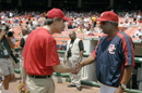 Secy Gutierrez shakes hands with Frank Robinson