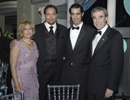 Secretary and Mrs. Carlos Gutierrez and son pose with Jimmy Smits