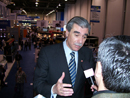 Commerce Secretary Carlos M. Gutierrez is interviewed on the trade show floor at CES.