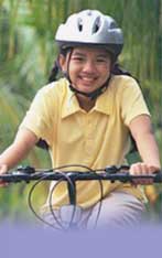 photo of girl in bicycle helmet