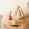 Photo of an Infant's Foot being Examined