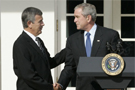 President George W. Bush shakes the hand of Mike Johanns, resigning Secretary of Agriculture, after he announced the secretary's decision to return to his home state of Nebraska during a morning statement in the Rose Garden.  White House photo by Joyce N. Boghosian