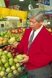 Photo of a man shopping for fruit. - Click to enlarge in new window.