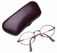 Photograph of eye glasses with case