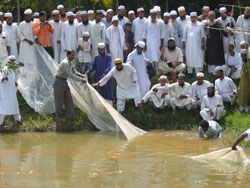Imams observing a fishery at a river