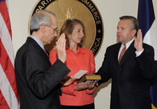 Justice Souter swears in Sullivan as his wife Grace, looks on.