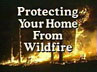 Video title "Protecting Your Home From Wildfire" on top of a blazing wildfire at night.