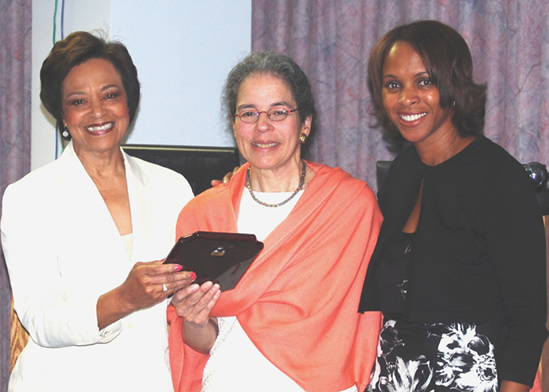 Guest speaker Dr. Nancy Adler (c), of the University of California, San Francisco, is shown with NICHD deputy director Dr. Yvonne Maddox (l) and Dr. Regina Smith James, director, Extramural Associates Program.
