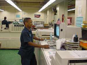 Image of Man Standing at Printer