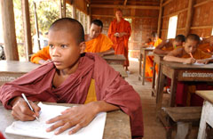 Photo of children orphaned by AIDS who have been ordained as novice monks and receive education in Kien Kes temple in Battambang province, Cambodia.