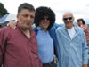 Mel Chudnof (center) tries on a Georgian traditional hat with Community Connections program alumni Levan Kopaleishvili and Levan Kizilashvili