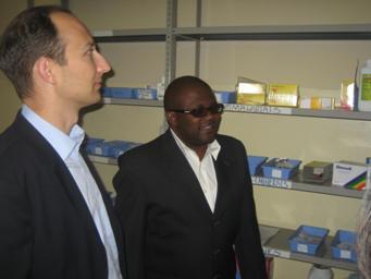 Deputy Secretary  Troy and Brian Chitangala, Director of Chreso Ministries, tour the antiretroviral treatment center at Chreso Ministries, where  volunteers from the Gospel Outreach Fellowship distribute antiretroviral treatments provided through PEPFAR.