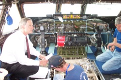 Senator Carper examines the cockpit of a C-5