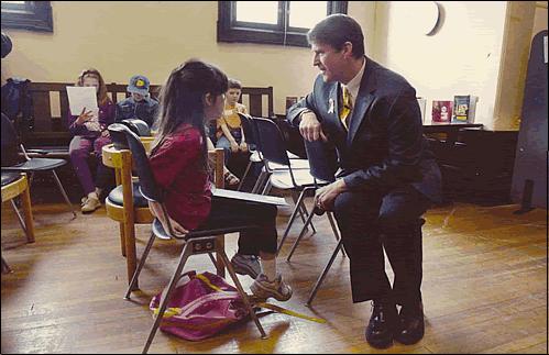 U.S. Rep. Michael McNulty (D-Green Island) presents the We the People Bookshelf to the Troy Public Library in New York (Daily Gazette, Schoy, NY, 5/1/04).