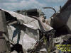 Vehicle destroyed at Parsons Plant, 7/14/2004.  Photo by Chris Geelhart, NWS.