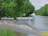 Water flows over Peoria Rd in Springfield, 5/14/2002.  Photo by Dan Smith, NWS.