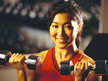 Photo of a woman lifting hand weights