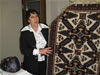 Kubra Aliyeva, a USAID Community Connections Handicraft Production and Marketing exchange participant, exhibits Azerbaijani carpet in Kansas City