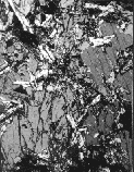 image of hard rock thin section under a petrographic microscope.