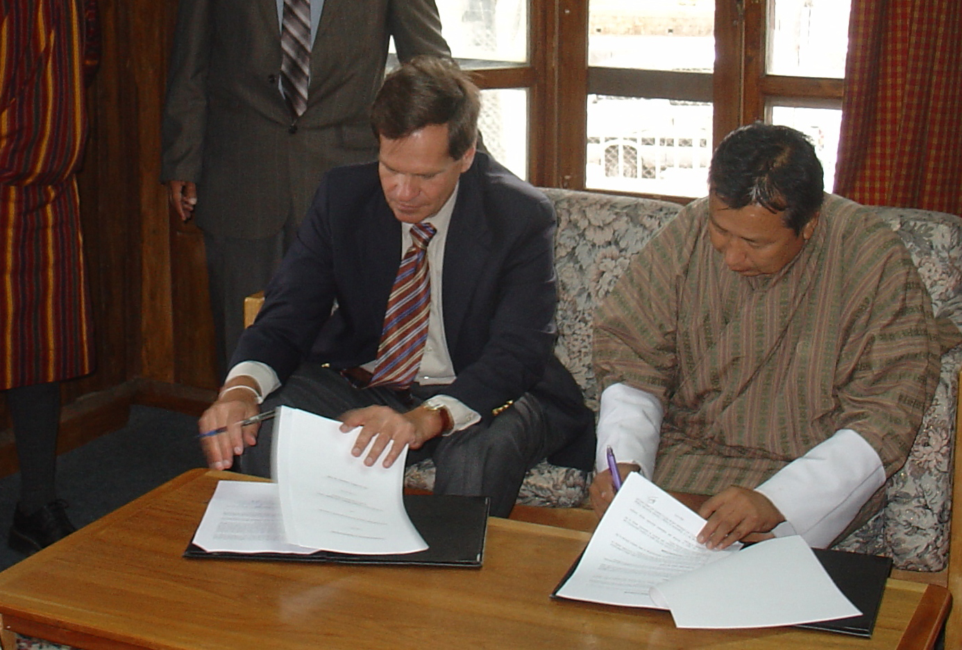 USAID/India Mission Director George Deikun and Energy Specialist, DOE/Royal Govt. of Bhutan Karma Chhothel (on behalf of the Director General) signing the MOU on July 10, 2008 in Thimpu (Bhutan). Photo Credit: USAID/India.