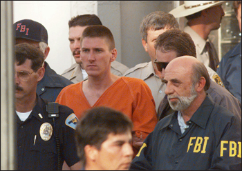 FBI agents help lead Timothy McVeigh from an Oklahoma courthouse on April 21, 1995. AP Photo.