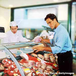 Photo: Man at a meat counter